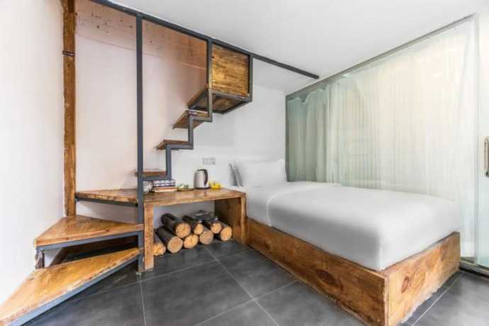 Imagen de la habitación del Hotel Floral Hotel Langzhong Pangmen College. Foto 10