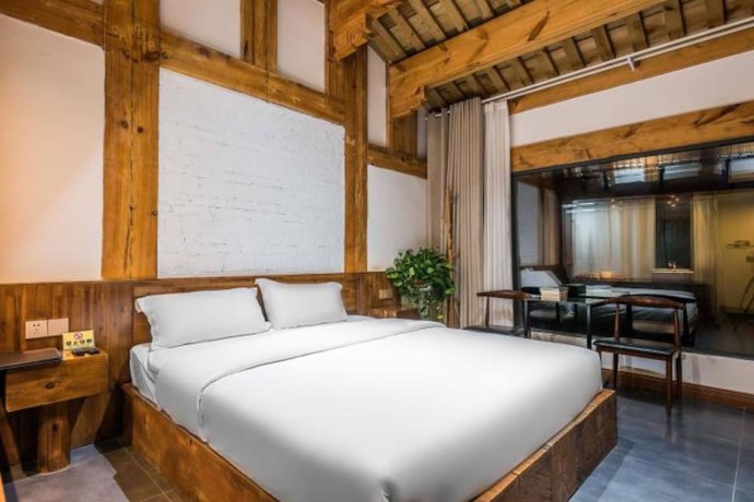 Imagen de la habitación del Hotel Floral Hotel Langzhong Pangmen College. Foto 13