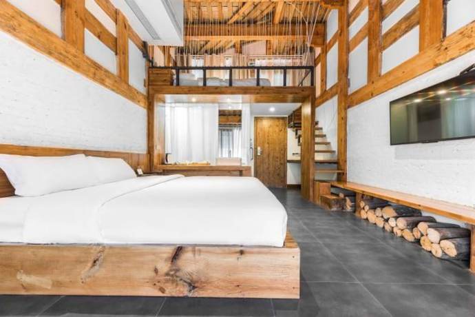 Imagen de la habitación del Hotel Floral Hotel Langzhong Pangmen College. Foto 14