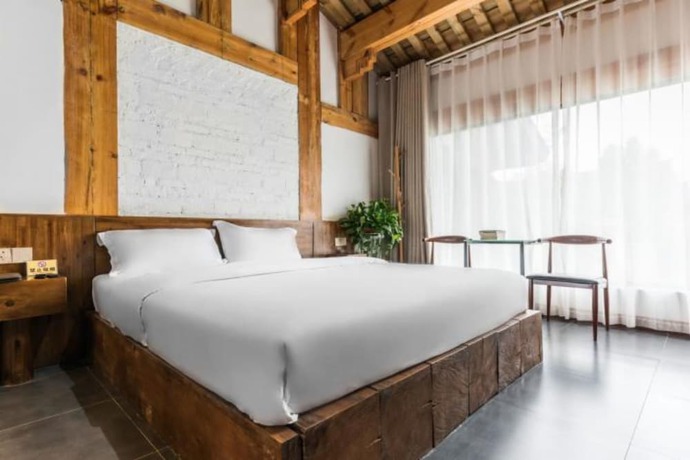 Imagen de la habitación del Hotel Floral Hotel Langzhong Pangmen College. Foto 15