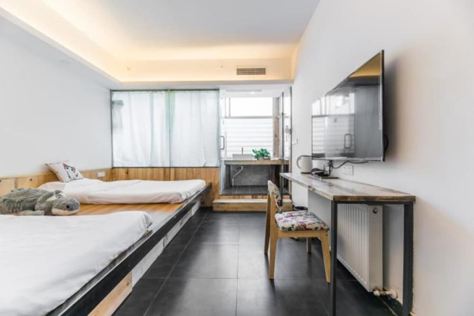 Imagen de la habitación del Hotel Floral Hotel Langzhong Pangmen College. Foto 16