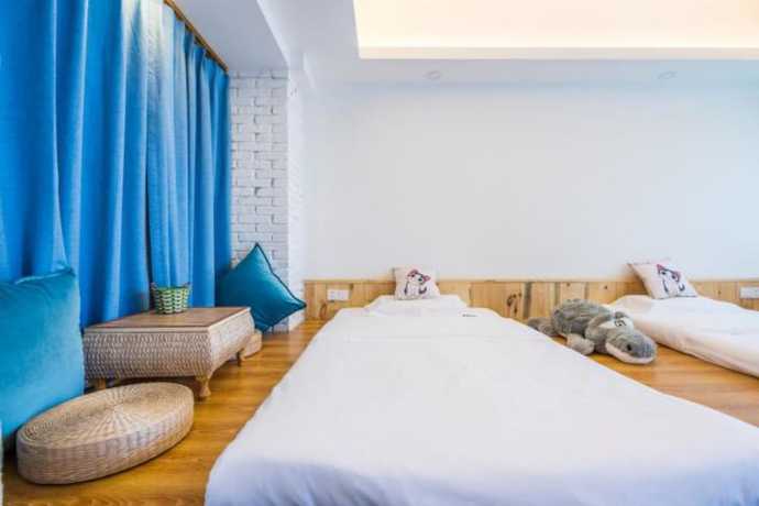 Imagen de la habitación del Hotel Floral Hotel Langzhong Pangmen College. Foto 17