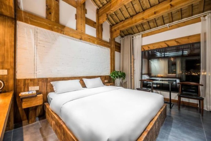 Imagen de la habitación del Hotel Floral Hotel Langzhong Pangmen College. Foto 18