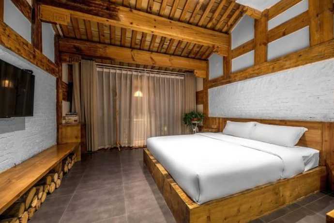 Imagen de la habitación del Hotel Floral Hotel Langzhong Pangmen College. Foto 20