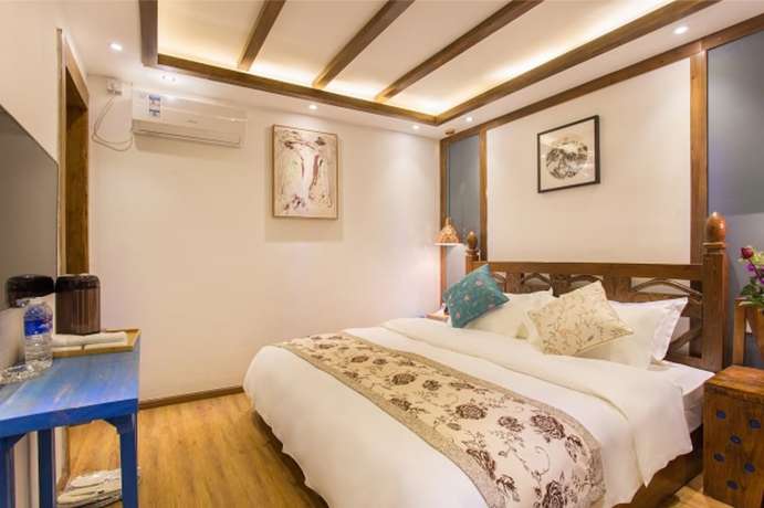 Imagen de la habitación del Hotel Floral Hotel Lijiang Exclusive Memory. Foto 13