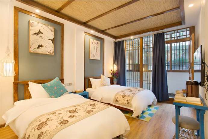 Imagen de la habitación del Hotel Floral Hotel Lijiang Exclusive Memory. Foto 18
