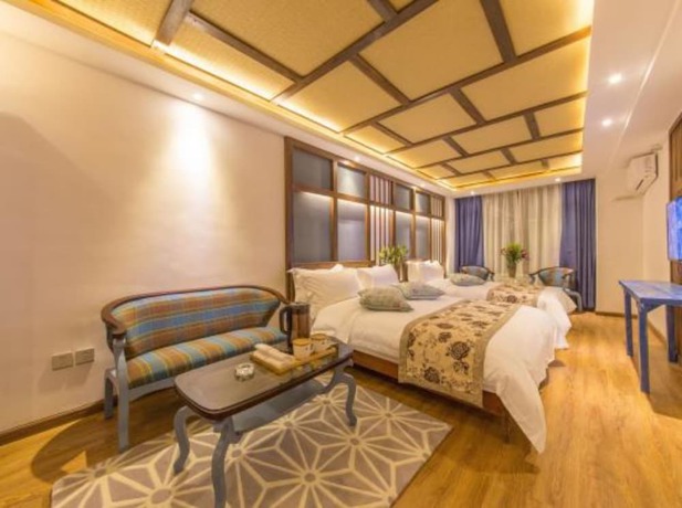 Imagen de la habitación del Hotel Floral Hotel Lijiang Exclusive Memory. Foto 19