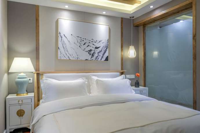 Imagen de la habitación del Hotel Floral Hotel Lijiang Huazizai. Foto 4