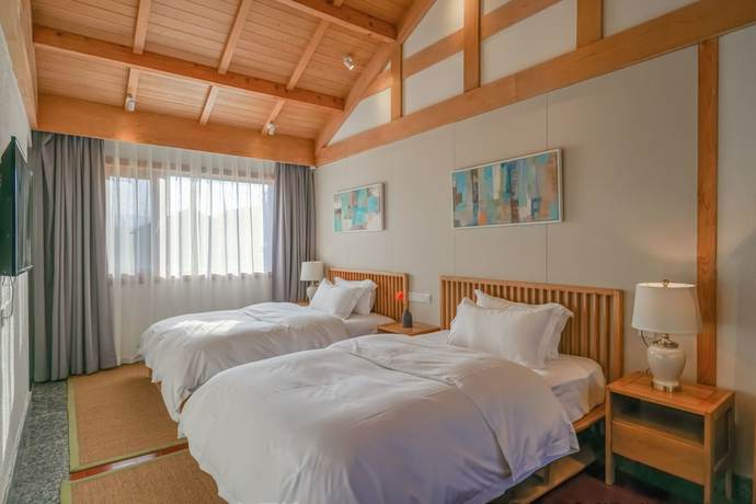 Imagen de la habitación del Hotel Floral Hotel Lijiang Huazizai. Foto 6