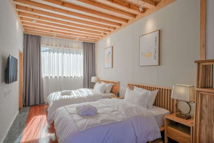 Imagen de la habitación del Hotel Floral Hotel Lijiang Huazizai. Foto 9