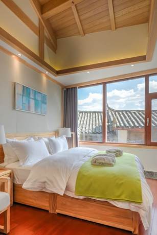 Imagen de la habitación del Hotel Floral Hotel Lijiang Huazizai. Foto 10