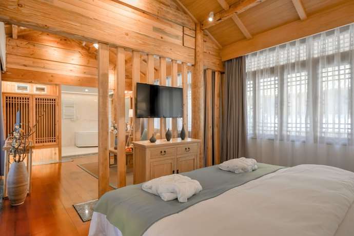 Imagen de la habitación del Hotel Floral Hotel Lijiang Huazizai. Foto 11