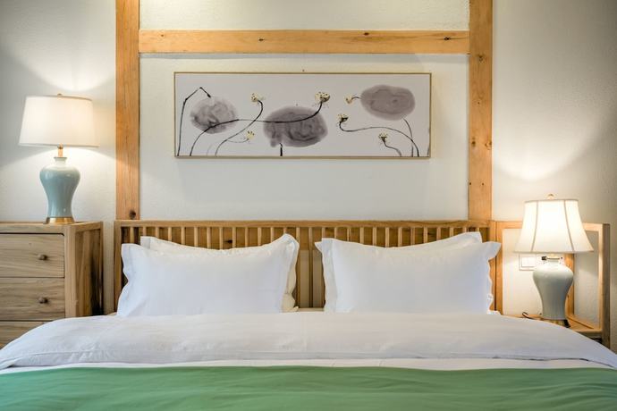 Imagen de la habitación del Hotel Floral Hotel Lijiang Huazizai. Foto 12