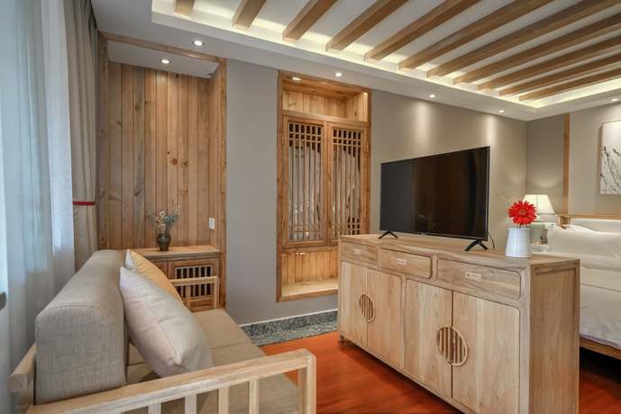 Imagen de la habitación del Hotel Floral Hotel Lijiang Huazizai. Foto 13