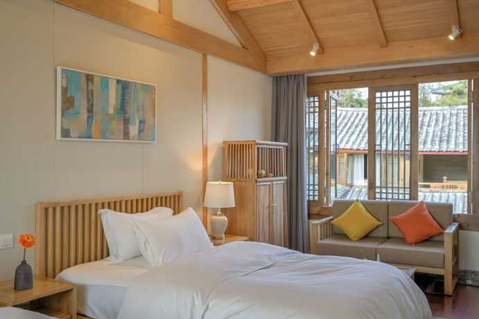 Imagen de la habitación del Hotel Floral Hotel Lijiang Huazizai. Foto 15