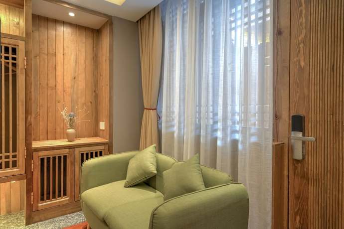 Imagen de la habitación del Hotel Floral Hotel Lijiang Huazizai. Foto 16