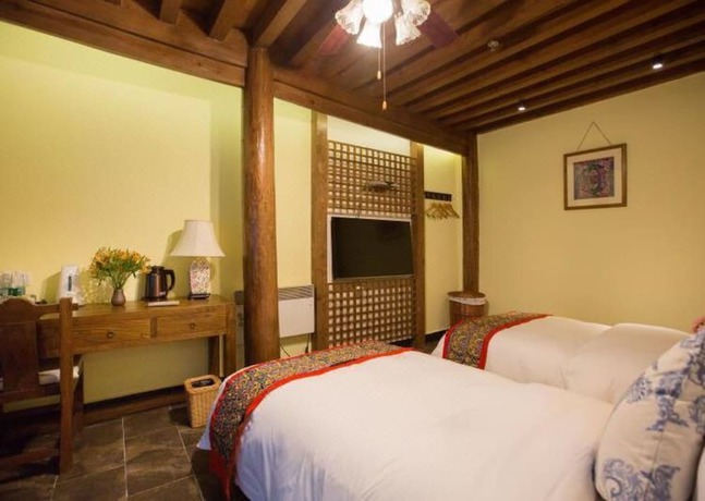 Imagen de la habitación del Hotel Floral Hotel Lijiang Mufu Qixi. Foto 2