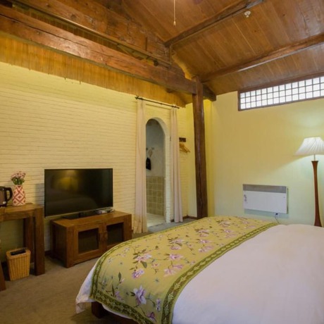 Imagen de la habitación del Hotel Floral Hotel Lijiang Mufu Qixi. Foto 3