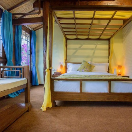 Imagen de la habitación del Hotel Floral Hotel Lijiang Mufu Qixi. Foto 10