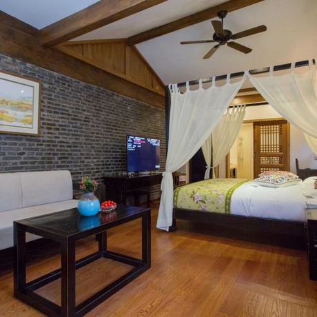 Imagen de la habitación del Hotel Floral Hotel Lijiang Mufu Qixi. Foto 13