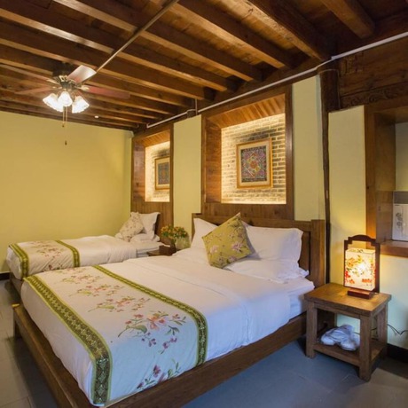 Imagen de la habitación del Hotel Floral Hotel Lijiang Mufu Qixi. Foto 15
