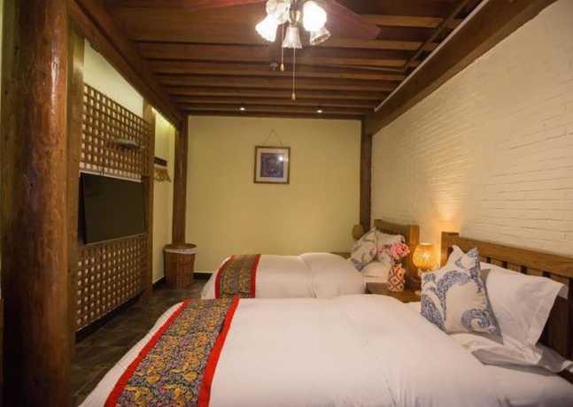Imagen de la habitación del Hotel Floral Hotel Lijiang Mufu Qixi. Foto 16