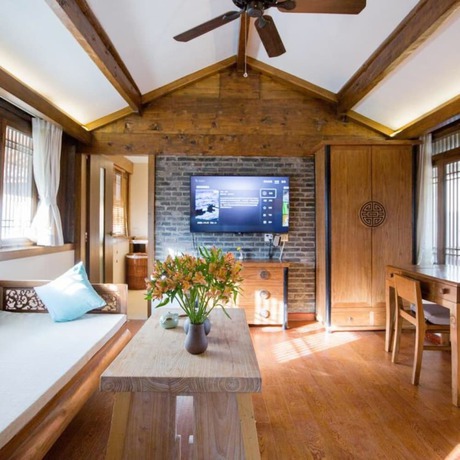 Imagen de la habitación del Hotel Floral Hotel Lijiang Mufu Qixi. Foto 17