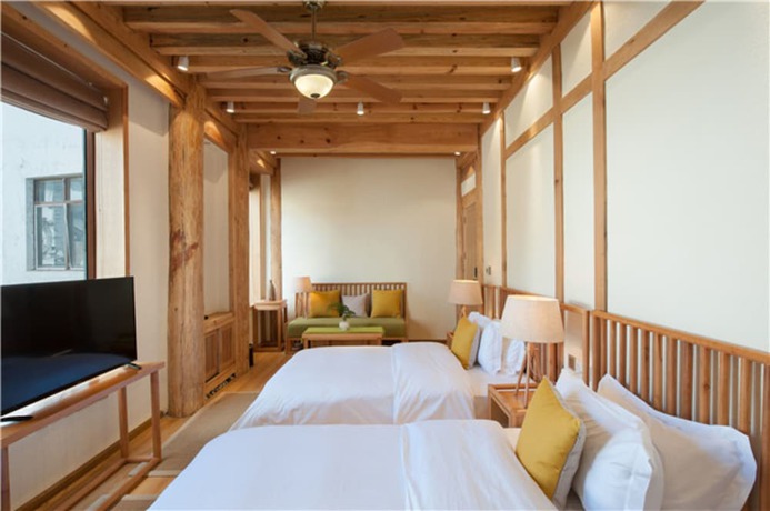 Imagen de la habitación del Hotel Floral Hotel Lijiang Nameiju. Foto 8