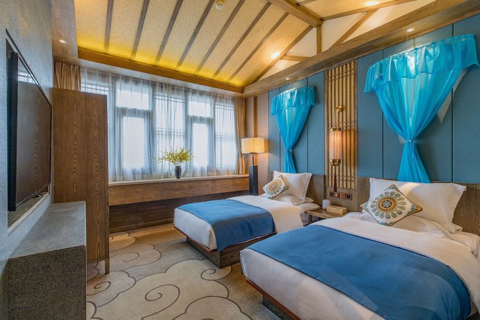 Imagen de la habitación del Hotel Floral Hotel Lijiang Qinyuan. Foto 10