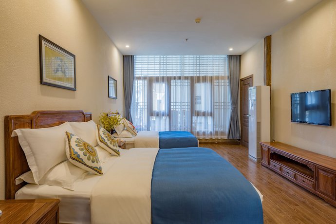 Imagen de la habitación del Hotel Floral Hotel Lijiang Qinyuan. Foto 16