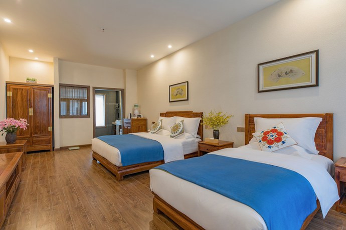 Imagen de la habitación del Hotel Floral Hotel Lijiang Qinyuan. Foto 18