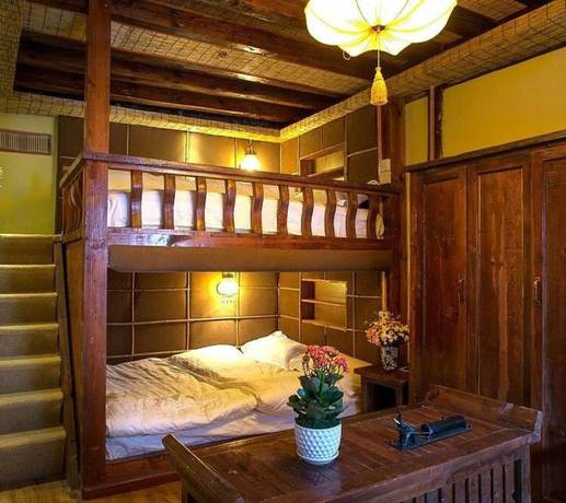 Imagen de la habitación del Hotel Floral Hotel Northern Cloudborn Lijiang. Foto 19