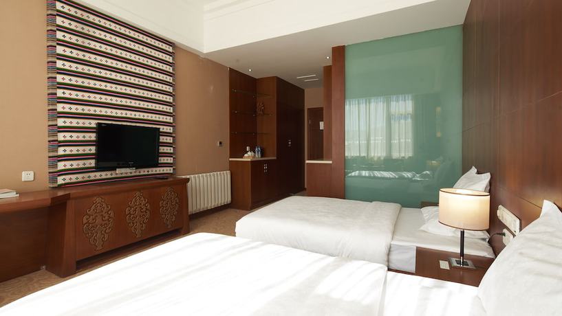 Imagen de la habitación del Hotel Floral Hotel Shangri-la Budange. Foto 7
