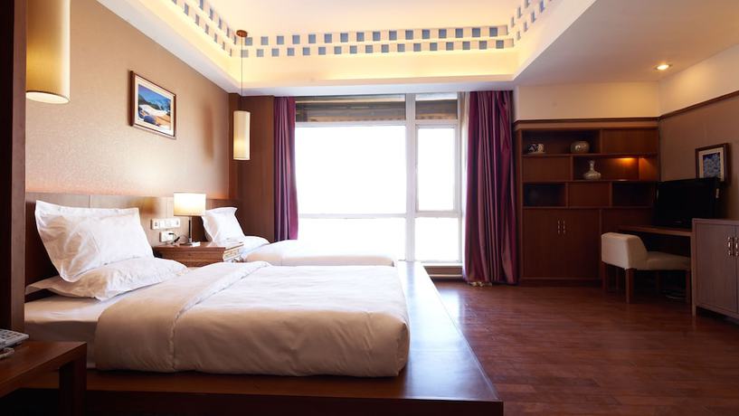 Imagen de la habitación del Hotel Floral Hotel Shangri-la Budange. Foto 9