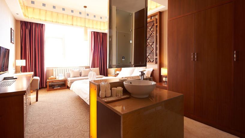 Imagen de la habitación del Hotel Floral Hotel Shangri-la Budange. Foto 10