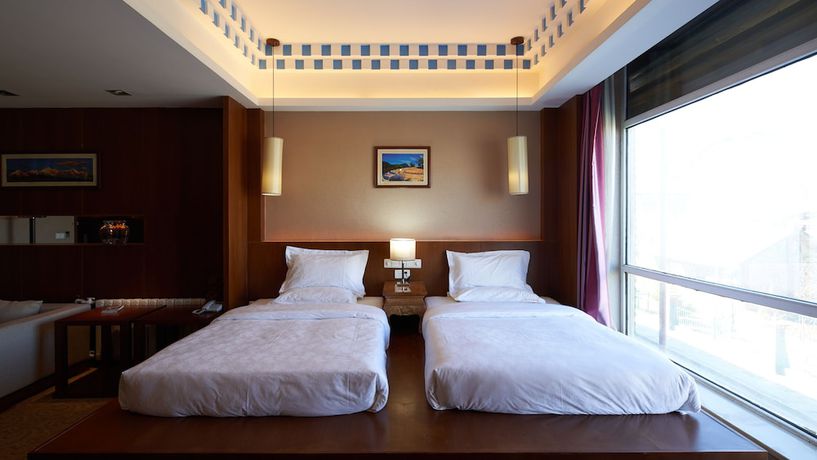 Imagen de la habitación del Hotel Floral Hotel Shangri-la Budange. Foto 12