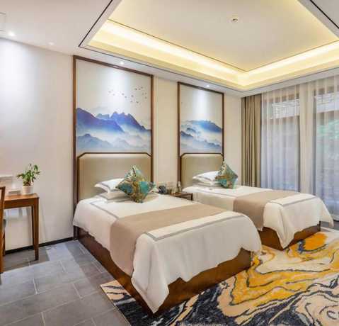 Imagen de la habitación del Hotel Floral Hotel Sheng Poman Courtyard. Foto 9