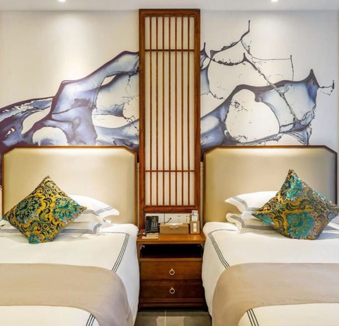 Imagen de la habitación del Hotel Floral Hotel Sheng Poman Courtyard. Foto 10