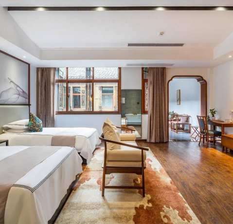 Imagen de la habitación del Hotel Floral Hotel Sheng Poman Courtyard. Foto 11