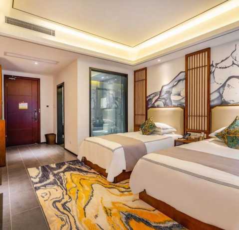 Imagen de la habitación del Hotel Floral Hotel Sheng Poman Courtyard. Foto 12