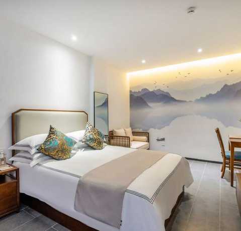 Imagen de la habitación del Hotel Floral Hotel Sheng Poman Courtyard. Foto 13