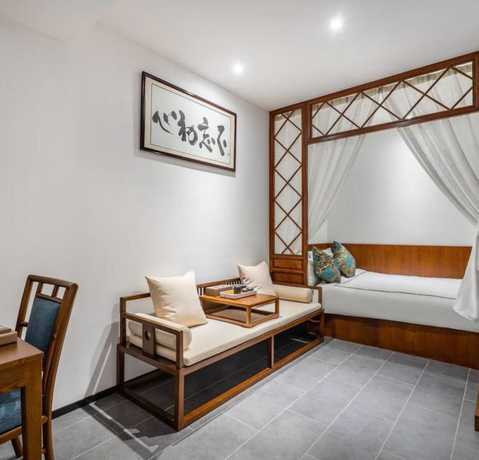 Imagen de la habitación del Hotel Floral Hotel Sheng Poman Courtyard. Foto 14