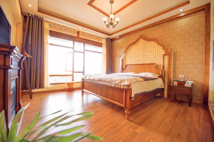 Imagen de la habitación del Hotel Floral Hotel Tengchong Heshun Hemuju. Foto 6