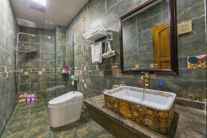 Imagen de la habitación del Hotel Floral Hotel Tengchong Heshun Hemuju. Foto 11