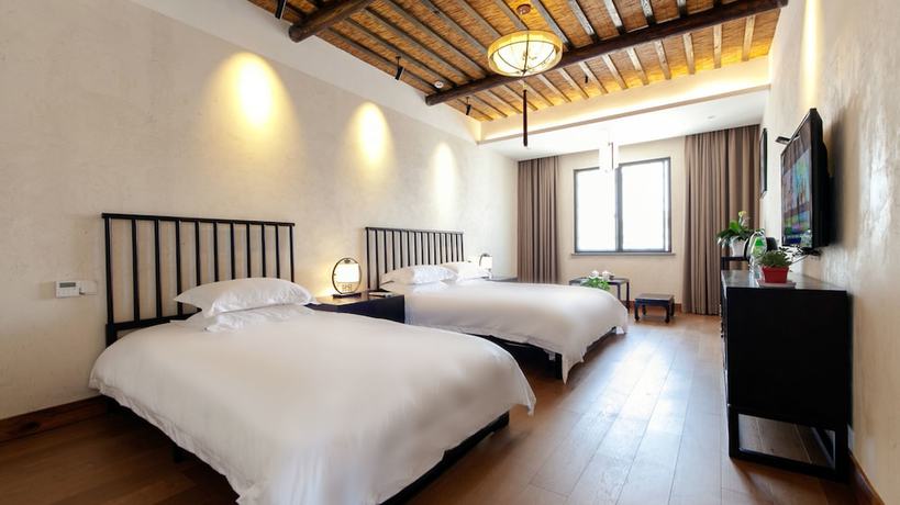 Imagen de la habitación del Hotel Floral Hotel Wuzhen Ziyemusu. Foto 7