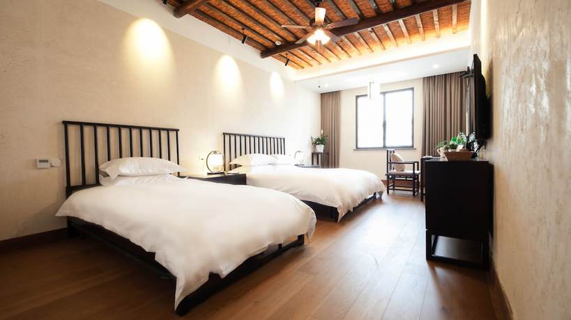 Imagen de la habitación del Hotel Floral Hotel Wuzhen Ziyemusu. Foto 8