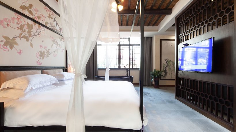 Imagen de la habitación del Hotel Floral Hotel Wuzhen Ziyemusu. Foto 11