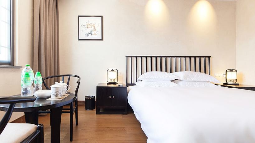 Imagen de la habitación del Hotel Floral Hotel Wuzhen Ziyemusu. Foto 14