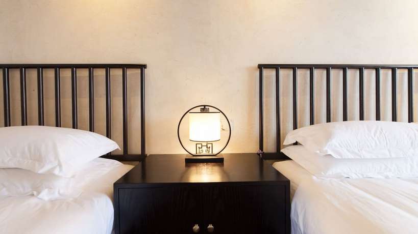 Imagen de la habitación del Hotel Floral Hotel Wuzhen Ziyemusu. Foto 15
