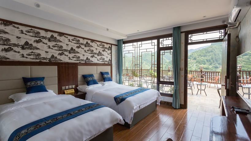 Imagen de la habitación del Hotel Floral Hotel Xijiang Banshan Yunfu. Foto 2